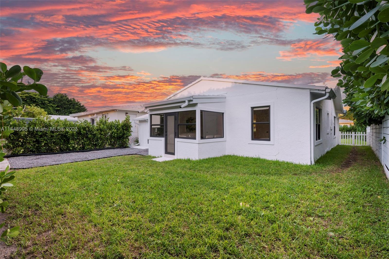 8844 Abbott Avenue Surfside, FL 33154 - Photo 7 of 11 a view of a house with a backyard