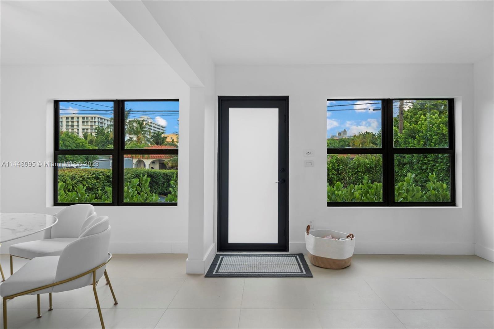 8844 Abbott Avenue Surfside, FL 33154 - Photo 10 of 11 a living room with furniture and a window
