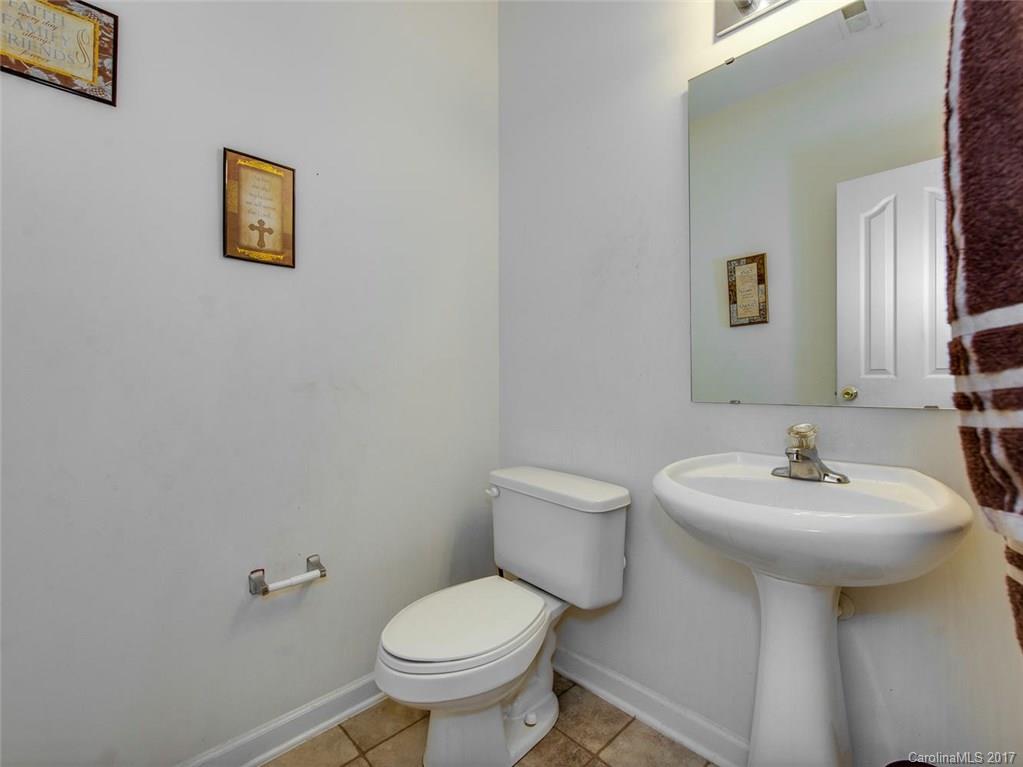 932 Garrison Road Charlotte, NC 28262 - Photo 11 of 20 a bathroom with a sink toilet and mirror