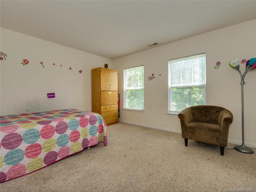 932 Garrison Road Charlotte, NC 28262 - Photo 15 of 20 a bedroom with a bed and a window