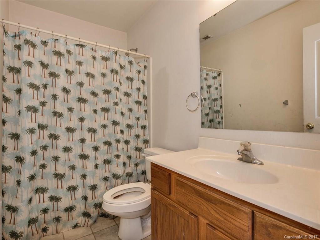 932 Garrison Road Charlotte, NC 28262 - Photo 16 of 20 a bathroom with a sink and a toilet