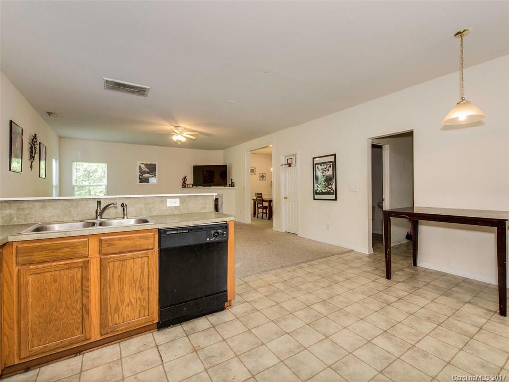932 Garrison Road Charlotte, NC 28262 - Photo 8 of 20 a kitchen with stainless steel appliances granite countertop a sink and cabinets