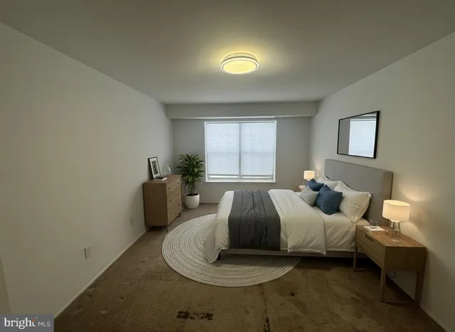 a bedroom with bed and window