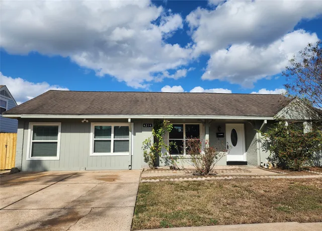 a view of a house with backyard porch and sitting area