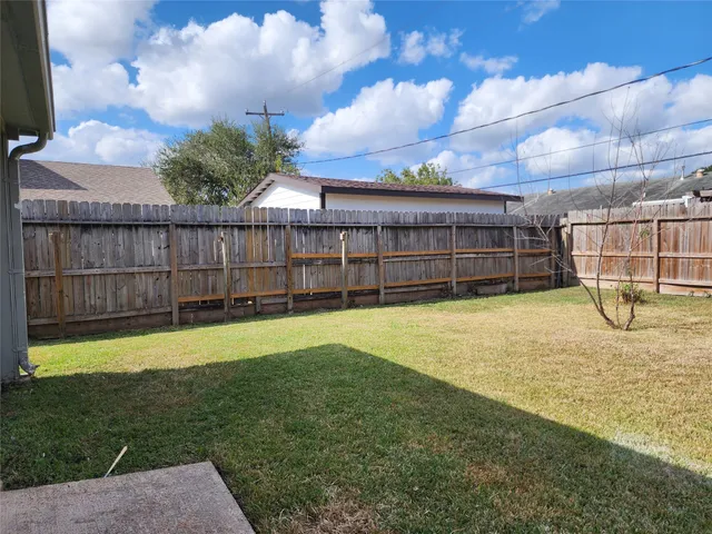 a view of a backyard with a small cabin