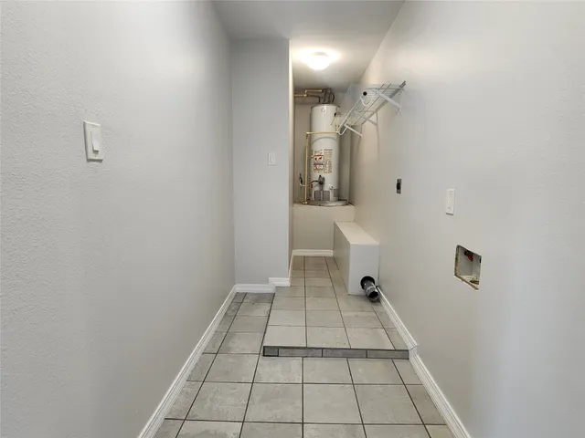 a view of a bathroom with a sink and mirror
