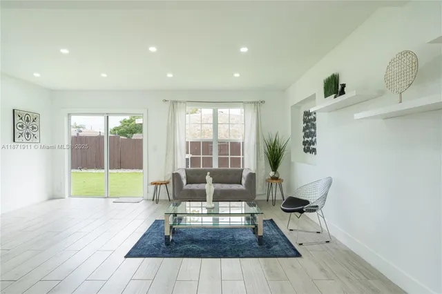 a living room with furniture and a table