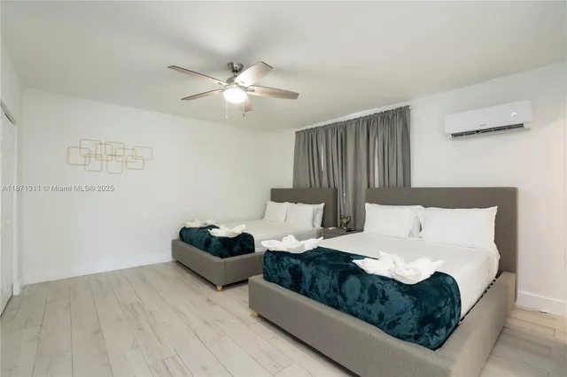 a bedroom with bed couch and window