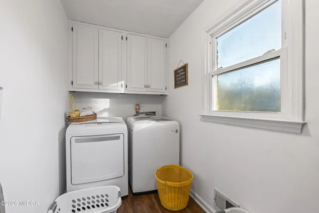 a view of bathroom with a toilet and a sink