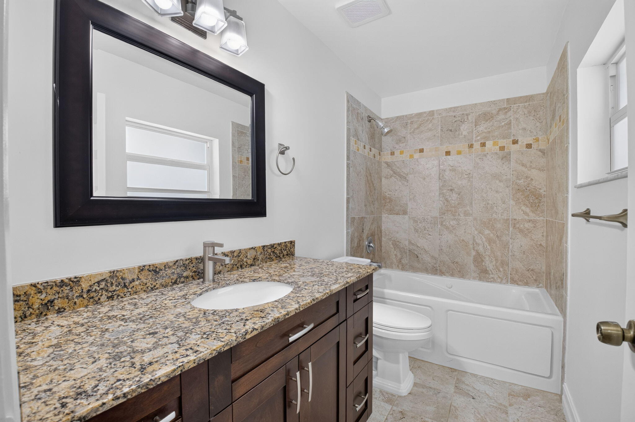 21070 Woodspring Avenue Boca Raton, FL 33428 - Photo 23 of 30 a bathroom with a granite countertop sink toilet and shower