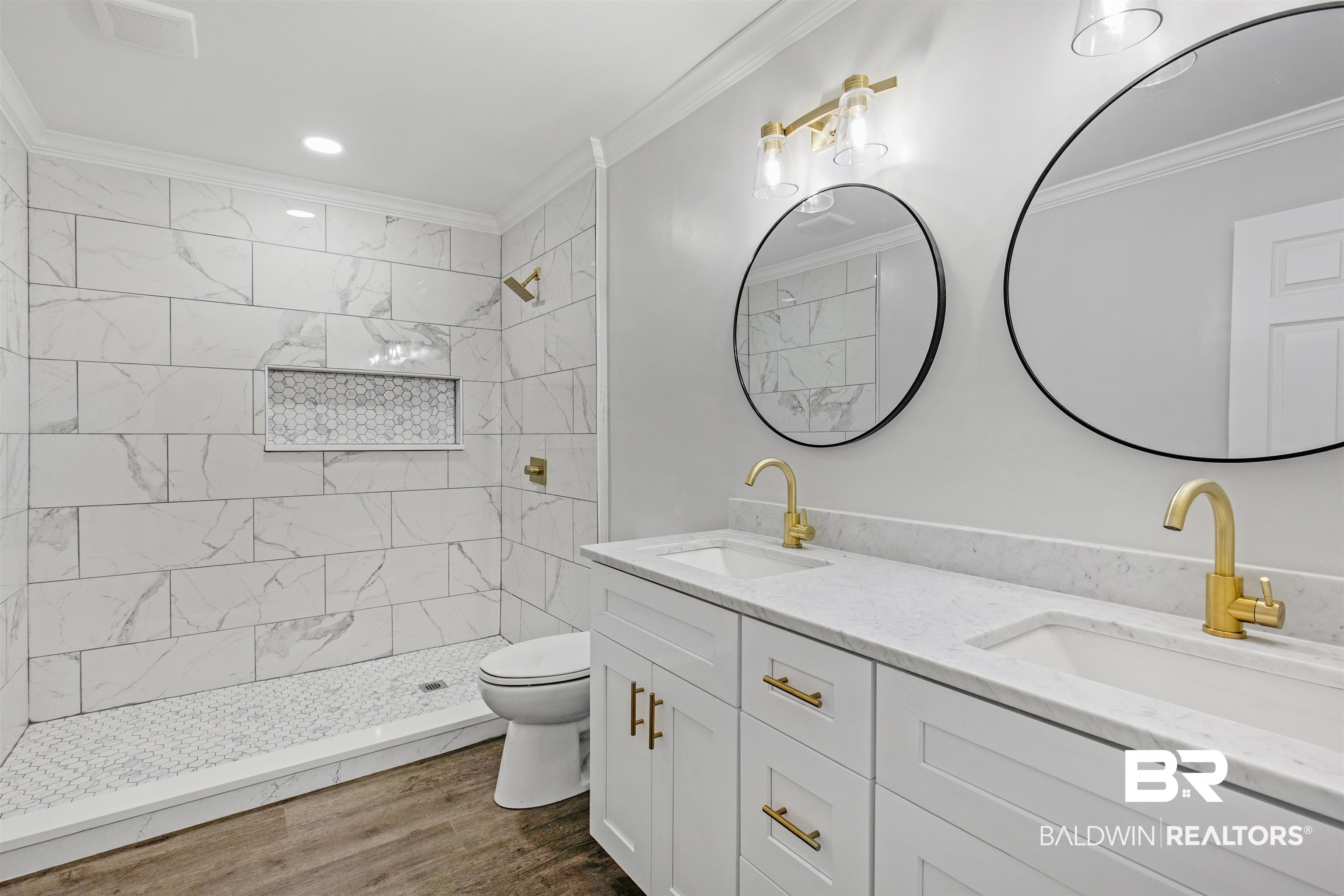 1432 South Polaris Drive Mobile, AL 36693 - Photo 17 of 27 Bathroom featuring ornamental molding, double vanity, a tile shower, and wood finished floors