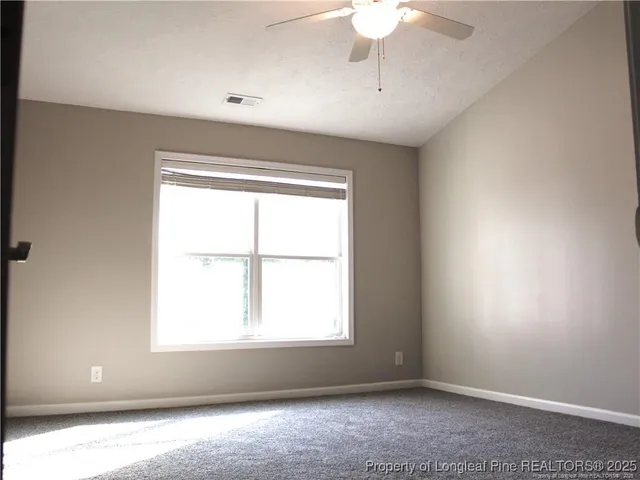 a view of a wooden fence