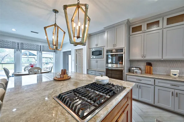 a kitchen with a sink stove and refrigerator