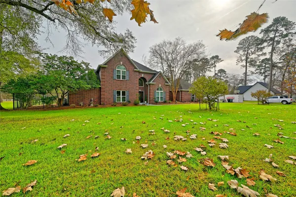 a front view of house with yard and green space