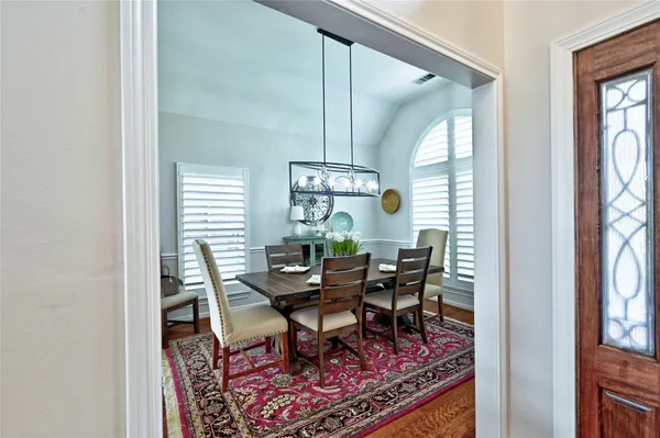 a living room with furniture ceiling fan and a rug