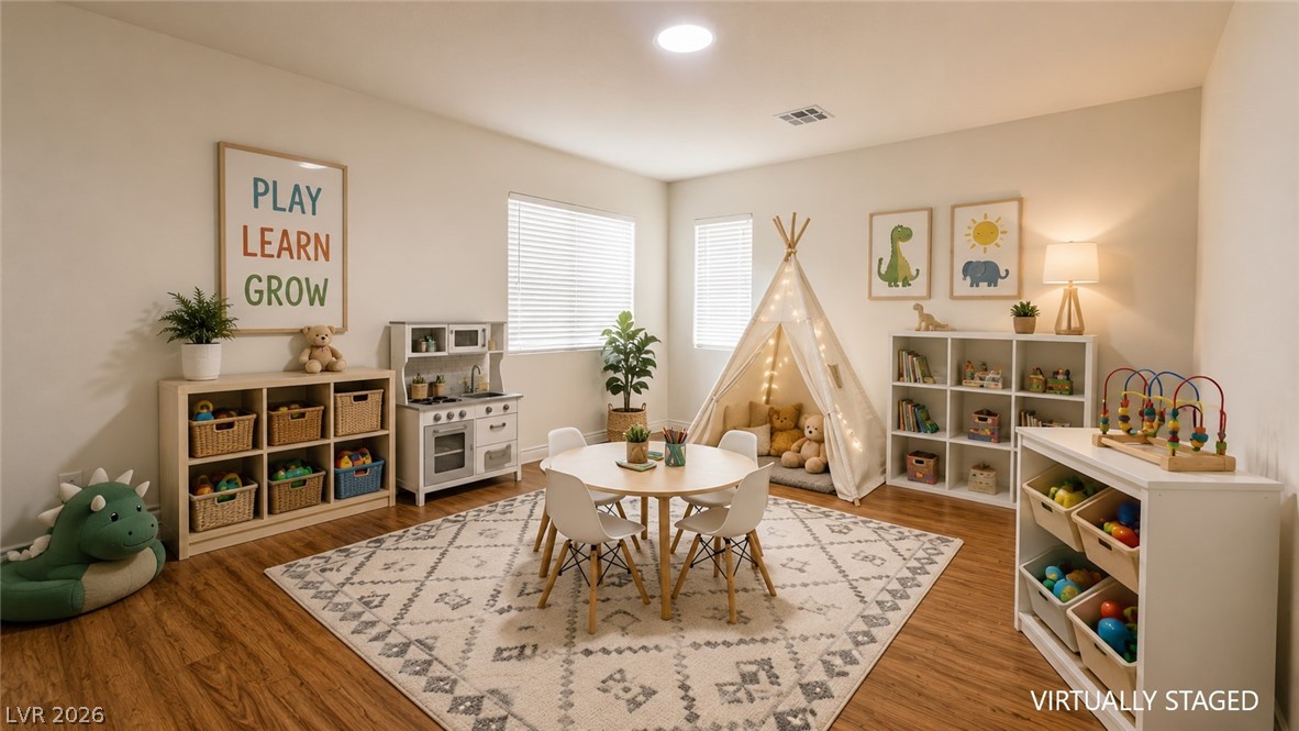 87 Tall Ruff Drive Las Vegas, NV 89148 - Photo 54 of 71 This playroom features ample natural light, hard surface flooring, and bright white walls, perfect for inspiring creativity.
