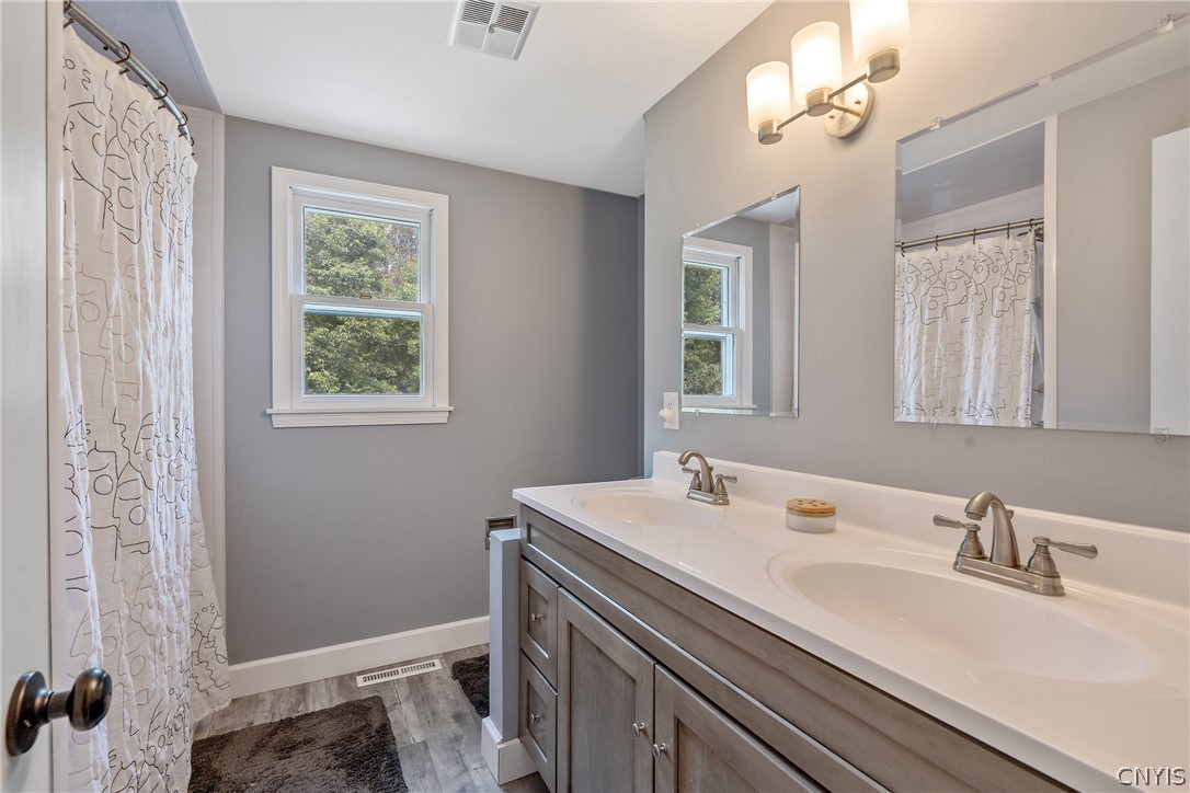 8069 Princess Path Clay, NY 13090 - Photo 35 of 50 The large main bath has also been updated and has