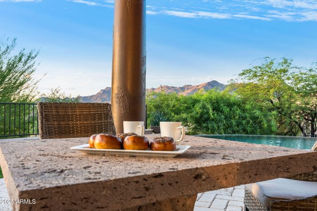 a living room with furniture fireplace and flat screen tv