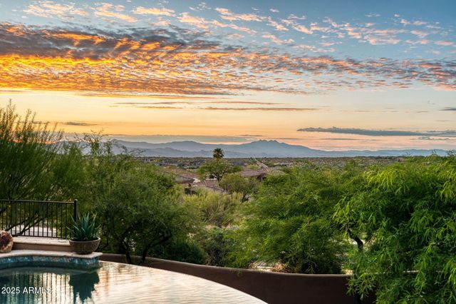 a view of a backyard with sitting area