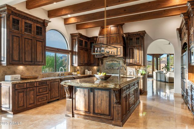 a kitchen with stainless steel appliances granite countertop a stove and a sink