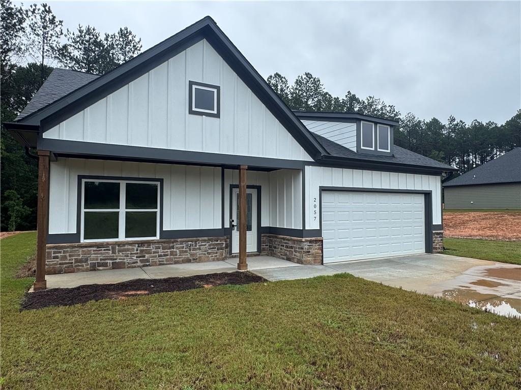 2057 North Hicks Road Toccoa, GA 30577 - Photo 1 of 22 a front view of a house with garden