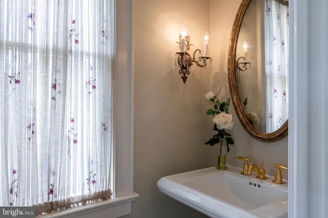 a bathroom with a sink and mirror