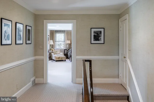 a view of hallway with livingroom and furniture