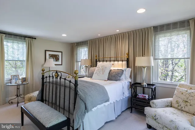 a bedroom with a bed and a couch