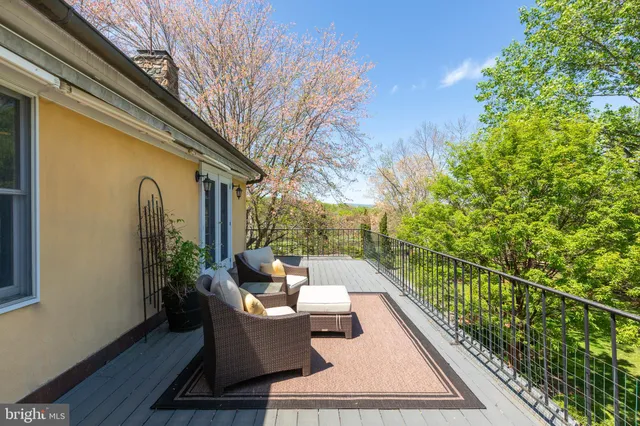 a view of balcony with furniture