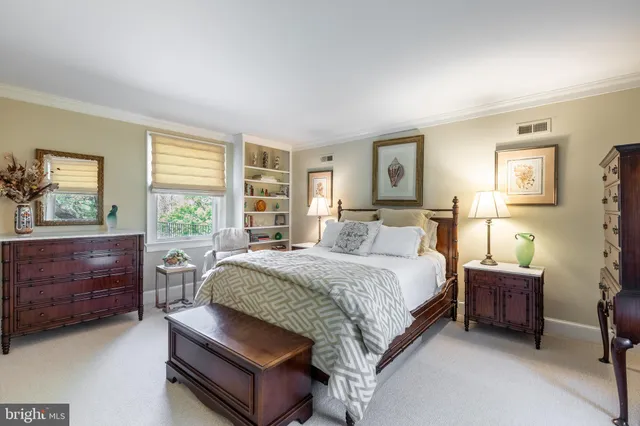 a bed room with a bed and a window