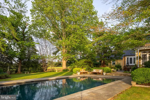a view of a swimming pool with a patio