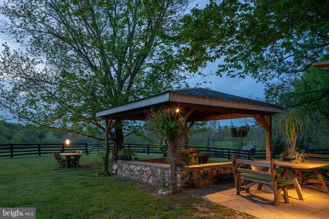 a view of backyard with sitting area
