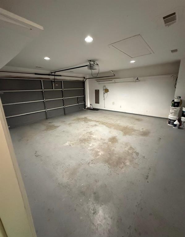 8001 Kings Ridge Road Frisco, TX 75035 - Photo 12 of 13 Garage featuring a garage door opener and electric panel