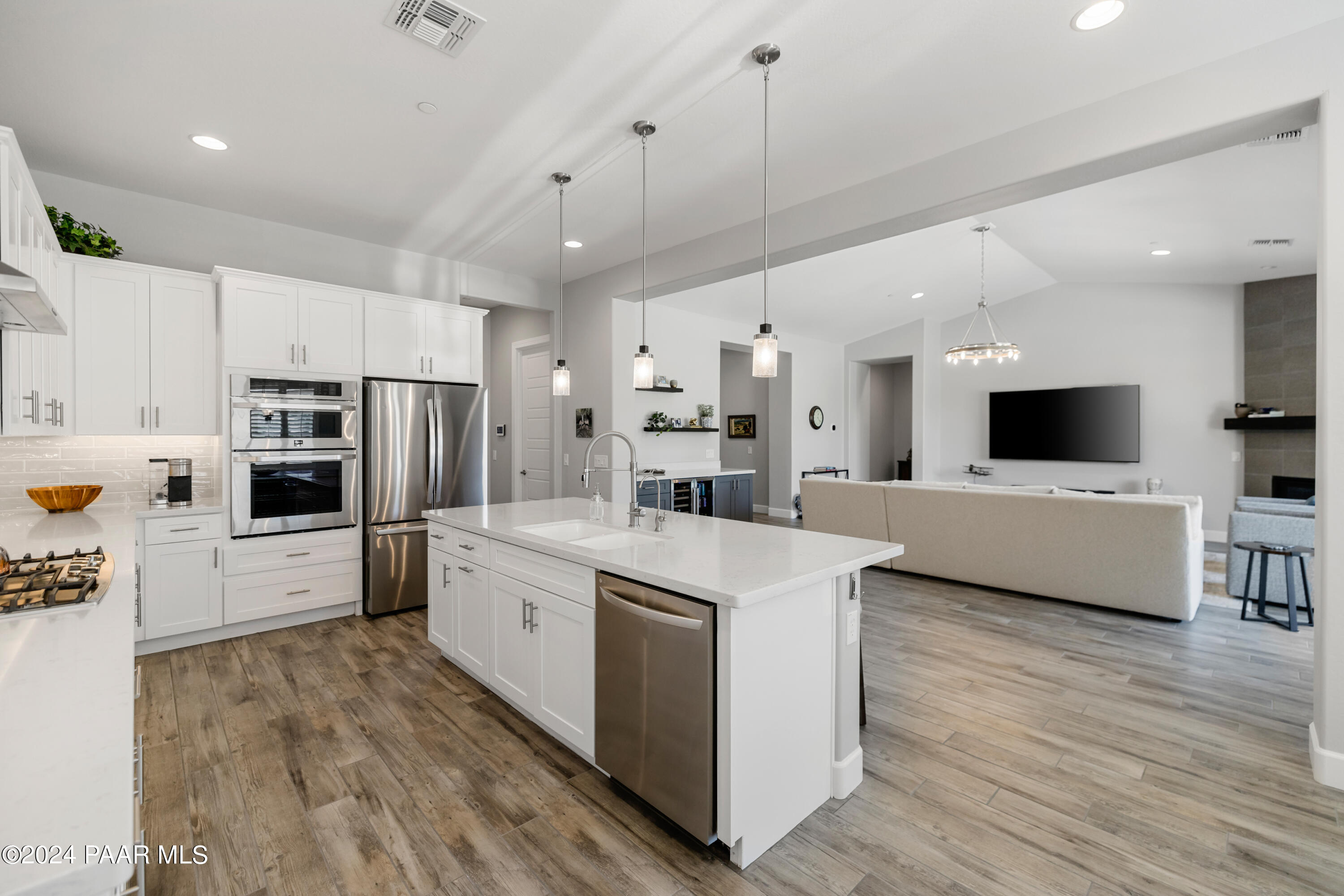 2800 Brooks Range Prescott, AZ 86301 - Photo 6 of 64 a large kitchen with stainless steel appliances kitchen island a sink a stove a refrigerator and a cabinets