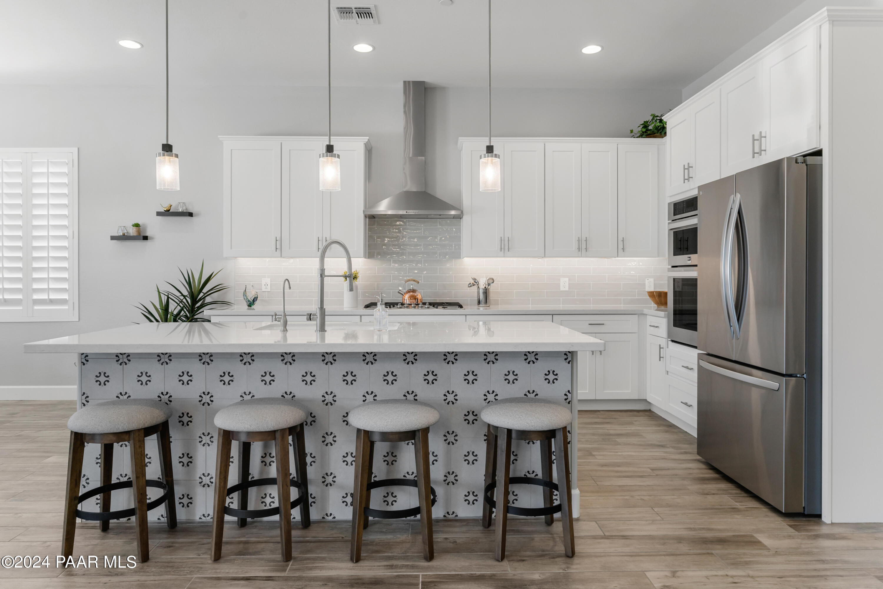 2800 Brooks Range Prescott, AZ 86301 - Photo 9 of 64 a kitchen with granite countertop a refrigerator and white cabinets