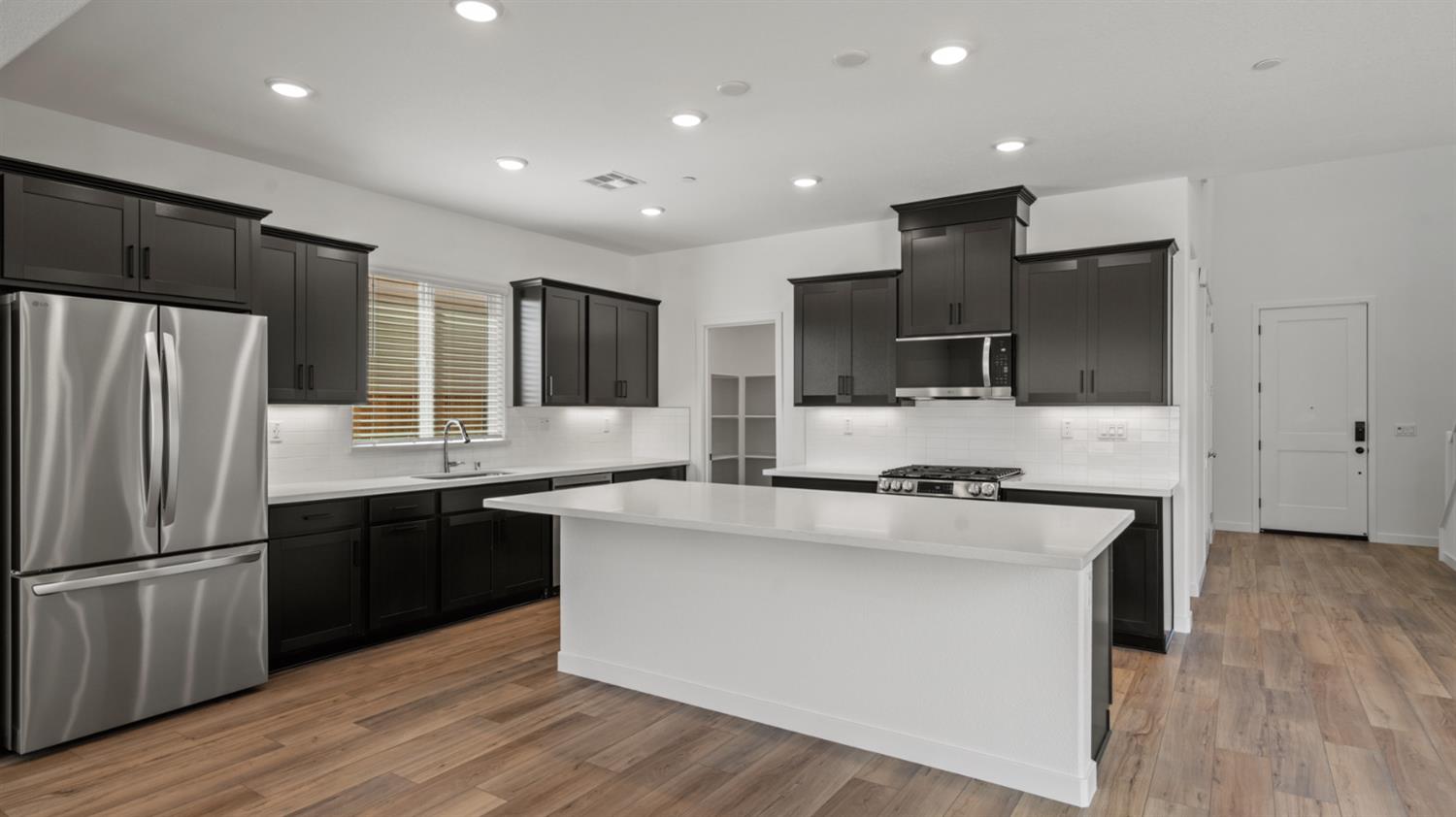 229 Rafters Court Lincoln, CA 95648 - Photo 2 of 13 a kitchen with stainless steel appliances granite countertop a refrigerator a sink a stove and oven