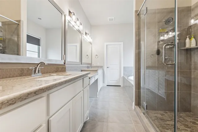 a spacious bedroom with a large bed and a window