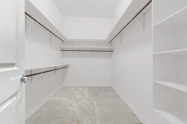 a bathroom with a tub a sink and a large window