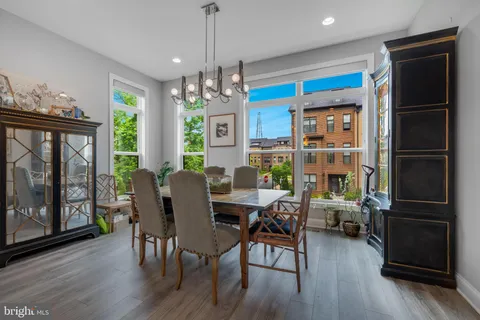 a view of a dining room with furniture window and wooden floor