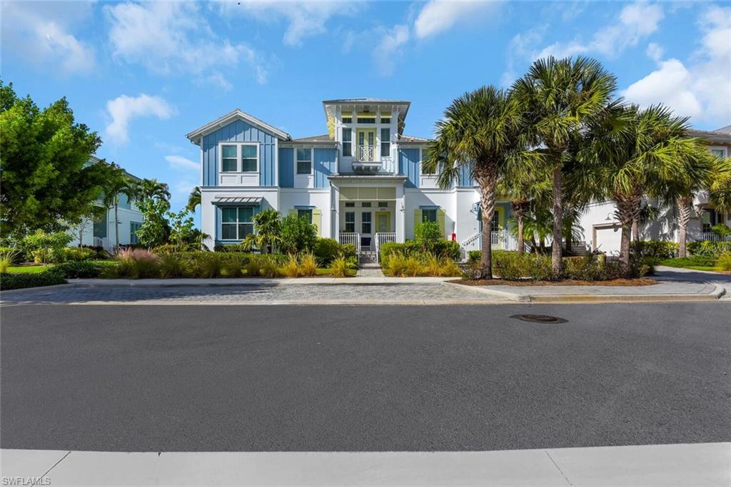 6561 Dominica Drive, Unit 8101 Naples, FL 34113 - Photo 1 of 46 front view of a house with a street