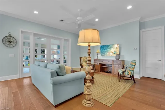 a living room with furniture fireplace and a table