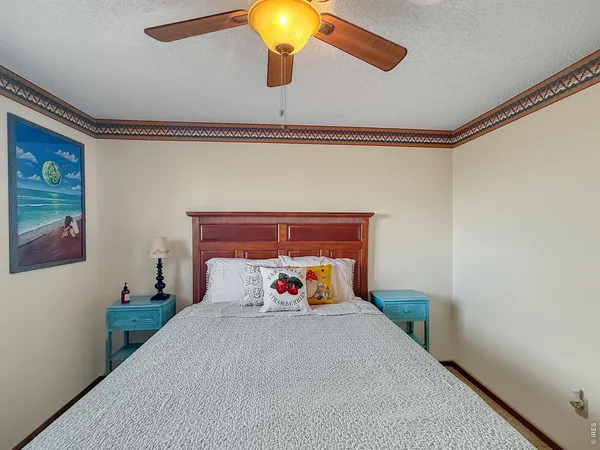 a bed room with a bed and a chandelier