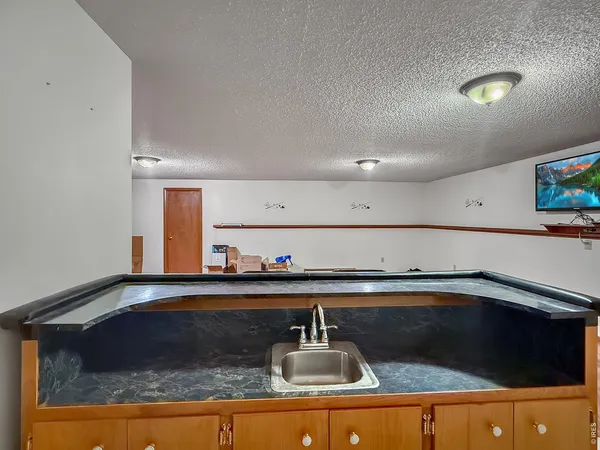 a kitchen with a sink and cabinets