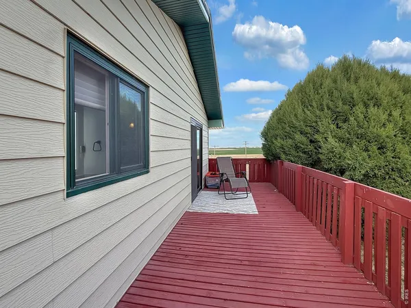 a view of a chairs and table in backyard