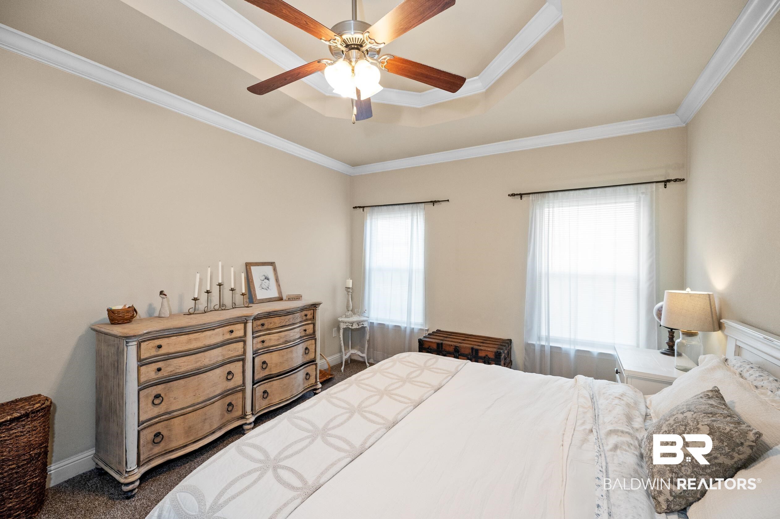745 Bonaventure Street Fairhope, AL 36532 - Photo 17 of 36 Bedroom with crown molding, ceiling fan, a tray ceiling, and multiple windows
