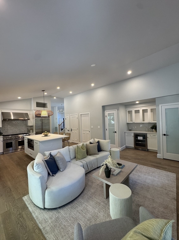 7 Wainwright Road, Unit 13 Winchester, MA 01890 - Photo 11 of 24 a living room with furniture and kitchen view