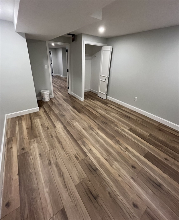 7 Wainwright Road, Unit 13 Winchester, MA 01890 - Photo 24 of 24 a view of a room with wooden floor and staircase