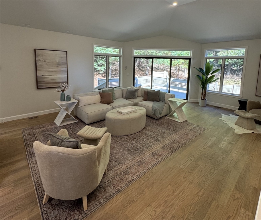 7 Wainwright Road, Unit 13 Winchester, MA 01890 - Photo 6 of 24 a living room with furniture and a large window