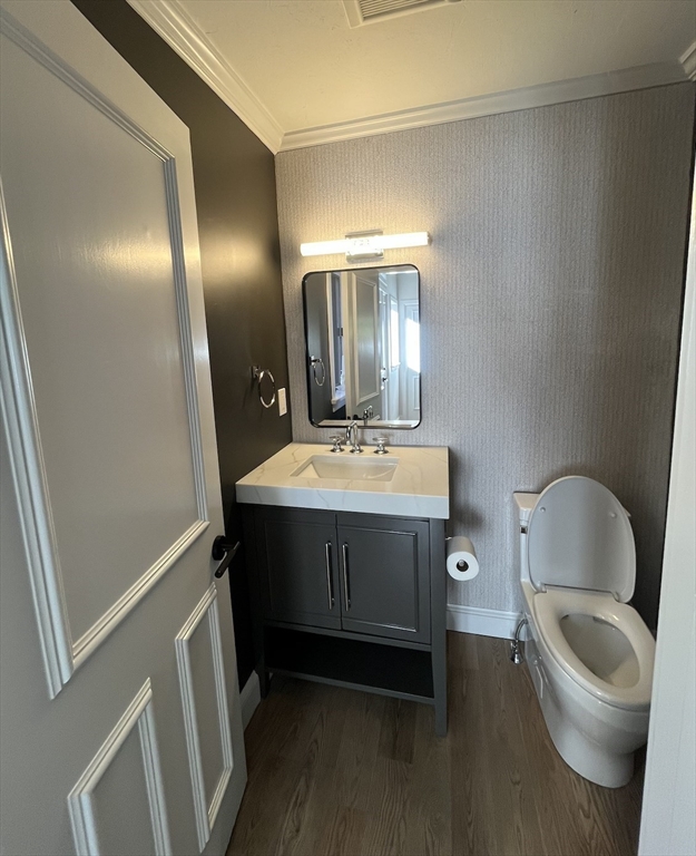 7 Wainwright Road, Unit 13 Winchester, MA 01890 - Photo 9 of 24 a bathroom with a sink toilet and mirror
