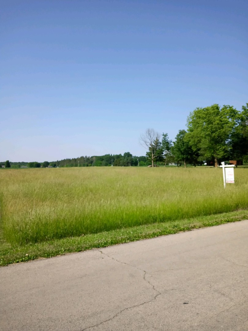 a view of a lake with a big yard